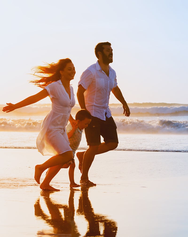 Family Running on a Beach