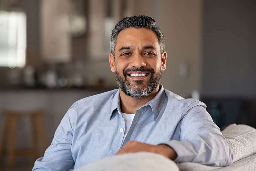 Man Smiling on a Couch